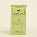 Seahorse Chocolate A.M. Gold packaging on a light yellow background