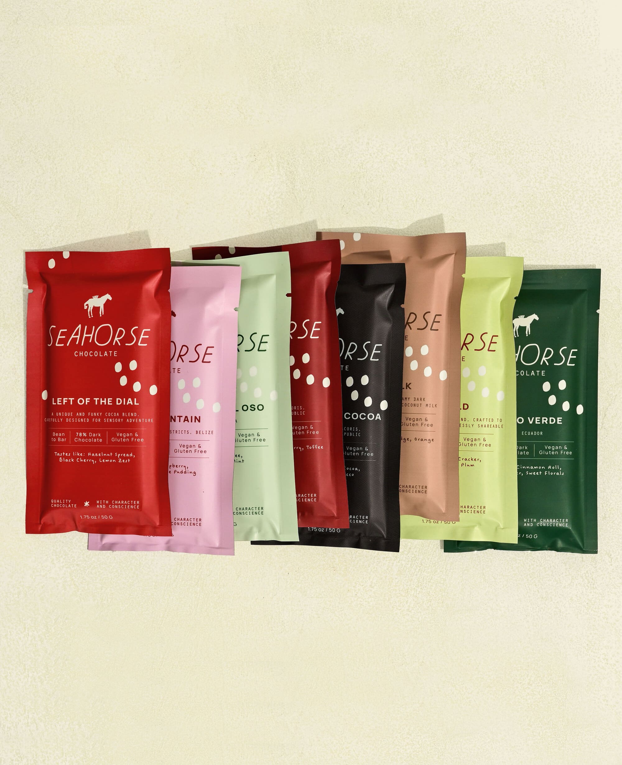 Seahorse Chocolate bars in various packaging colors on a beige background