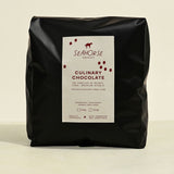 Black bag of Seahorse Culinary Chocolate on a beige background