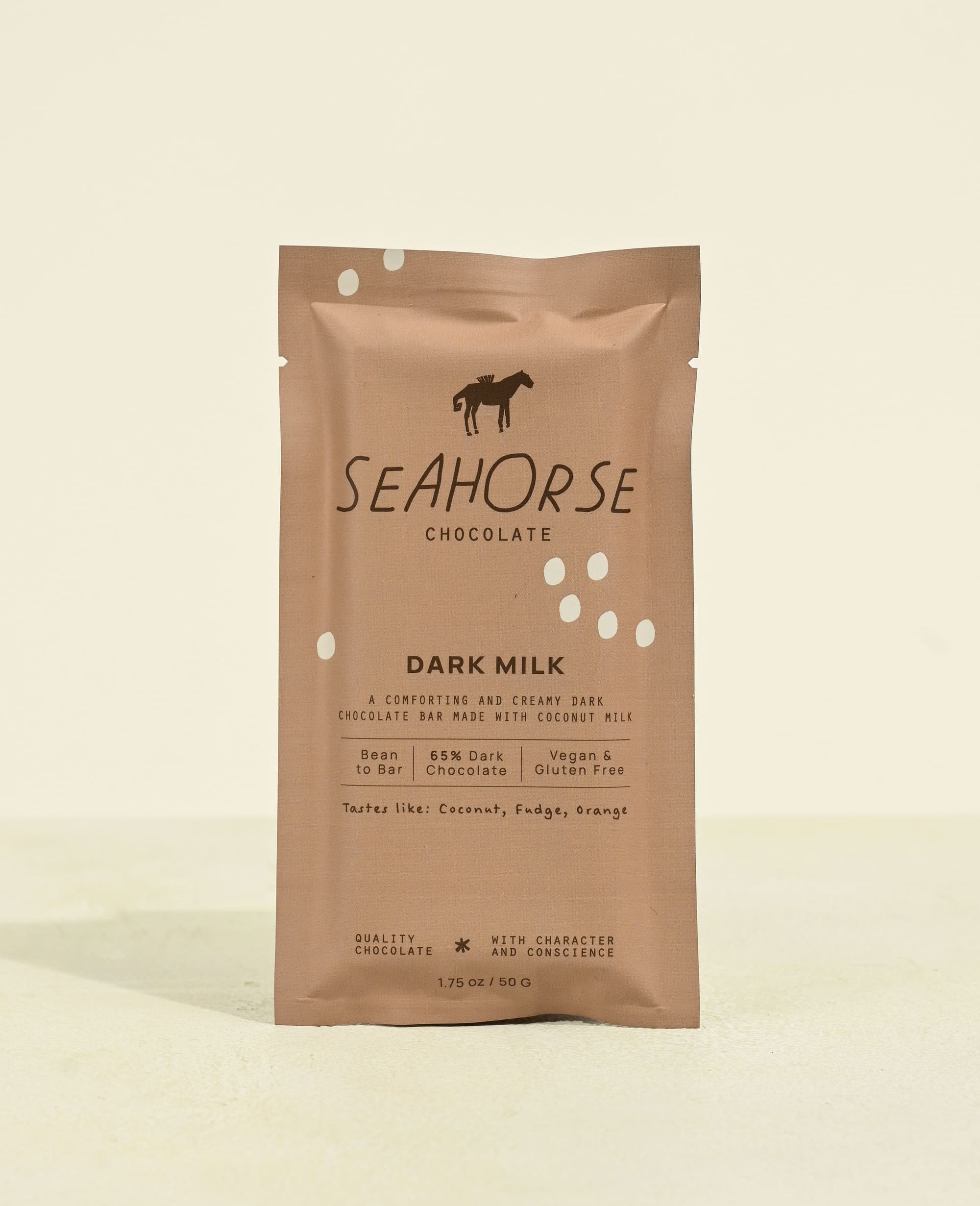 Seahorse Chocolate dark milk chocolate bar packaging on a beige background