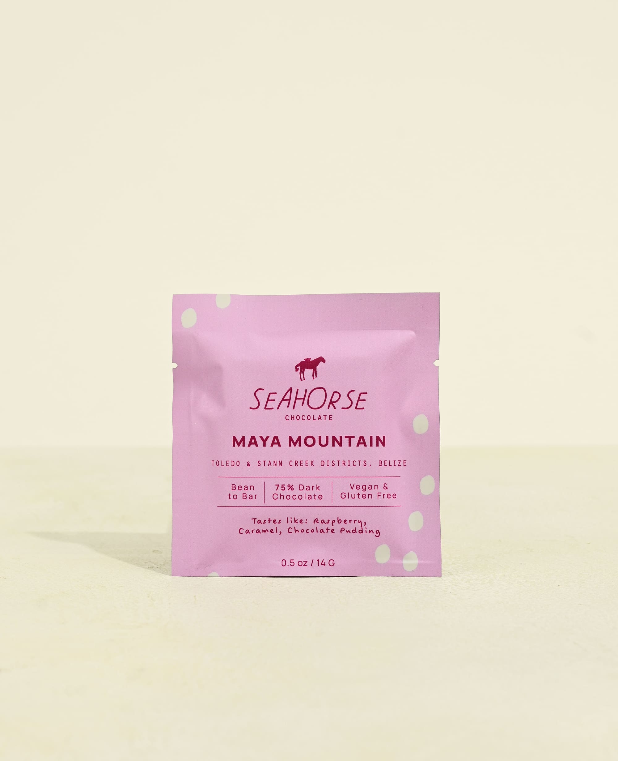 Seahorse Chocolate Maya Mountain chocolate bar packaging half ounce on a light pink background