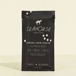 Seahorse Chocolate Zorzal 100% Cocoa packaging on a beige background