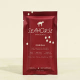 Red packaging of Seahorse Chocolate on a beige background